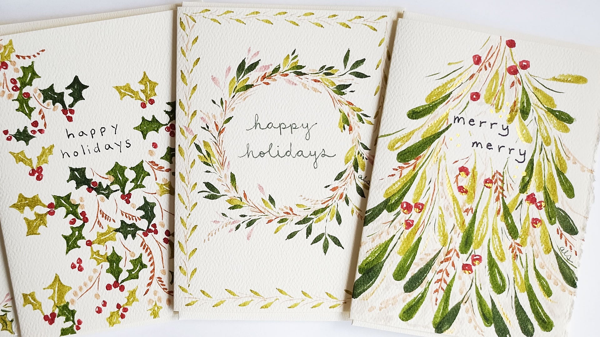 Three Christmas-themed greeting cards with holly leaves, berries, and wreaths on a white background.