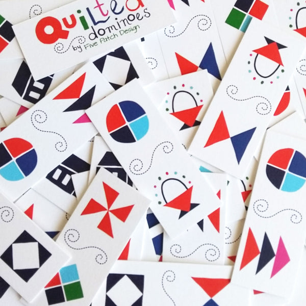 Five Patch Design Quilted Dominoes game pieces shown in a pile